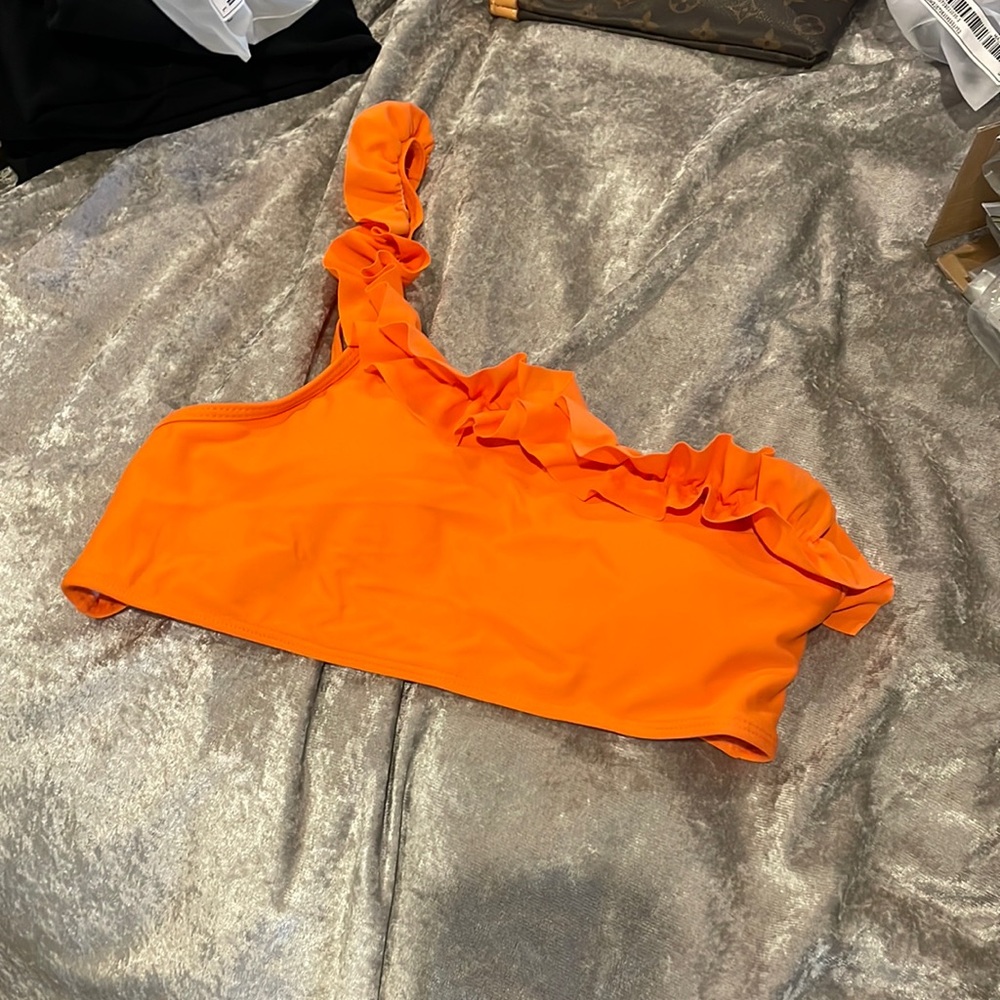 New never worn orange swimsuit top with pads